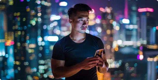 Affiliate checking a phone at night